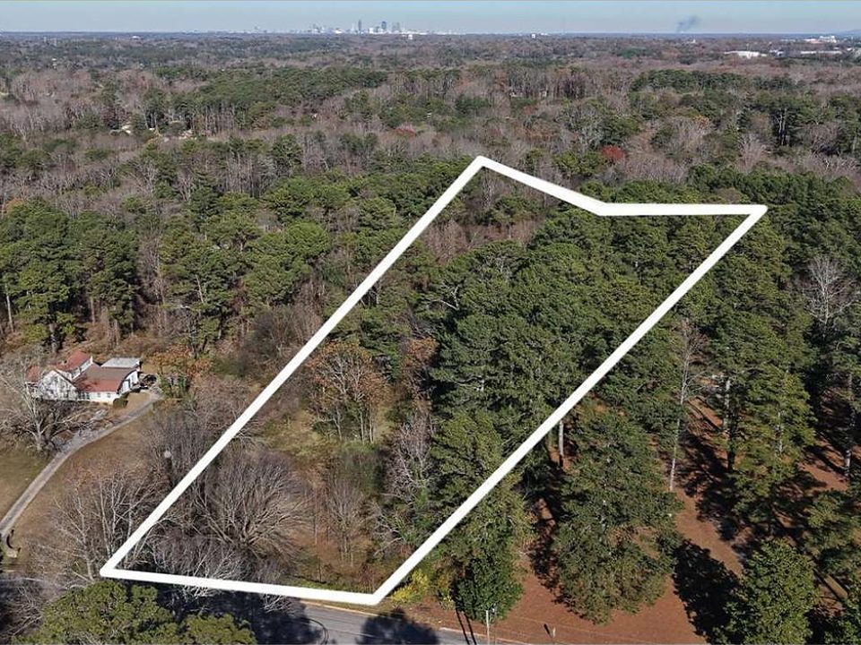 Aerial view of a 3.78-acre wooded parcel outlined in white
